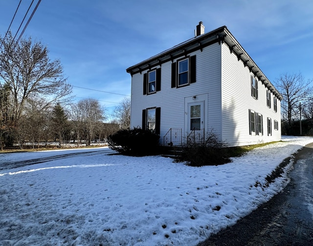 view of snow covered property