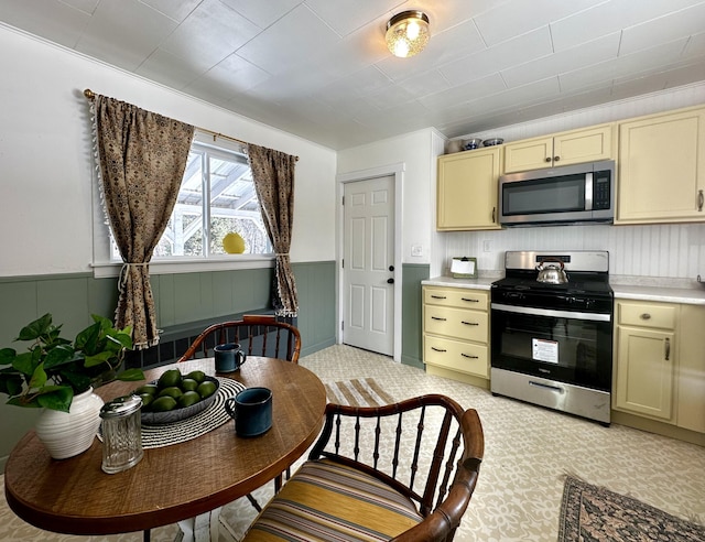 kitchen with stainless steel appliances and cream cabinets