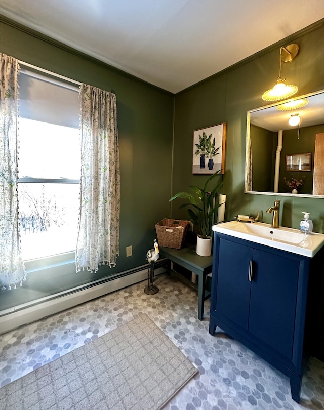 bathroom with vanity and a baseboard heating unit