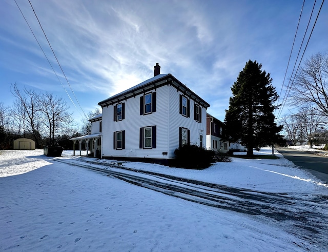 view of snow covered property