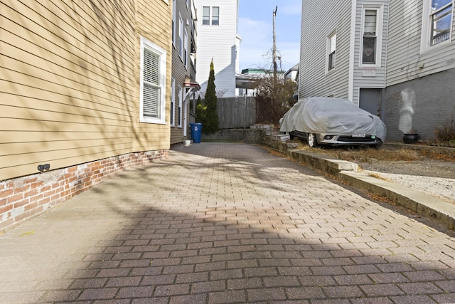 view of side of property featuring a patio area