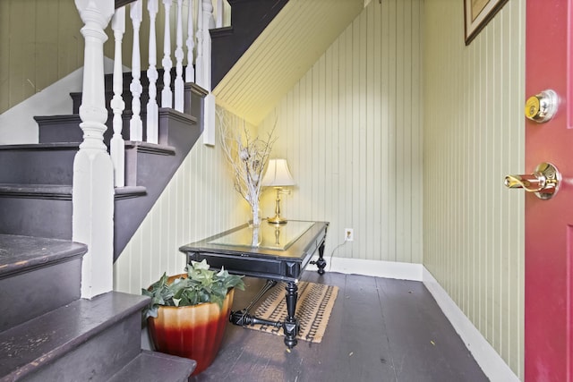 stairway with wooden walls