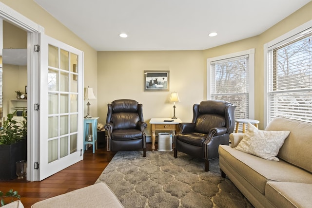 living area with french doors and dark hardwood / wood-style floors