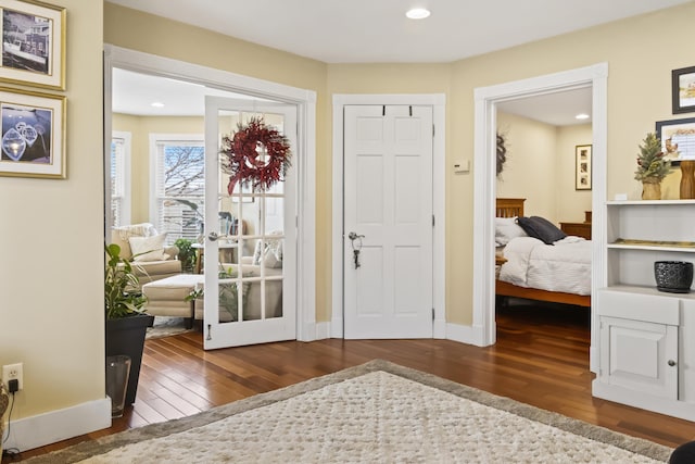 foyer entrance featuring dark hardwood / wood-style flooring