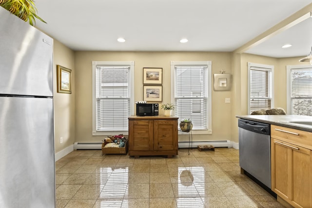 kitchen featuring baseboard heating and appliances with stainless steel finishes