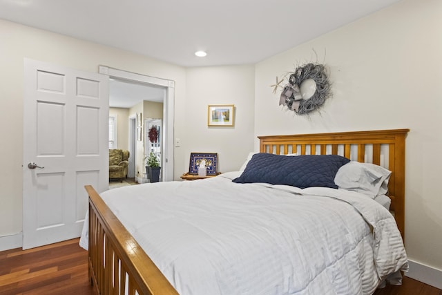 bedroom featuring dark hardwood / wood-style flooring