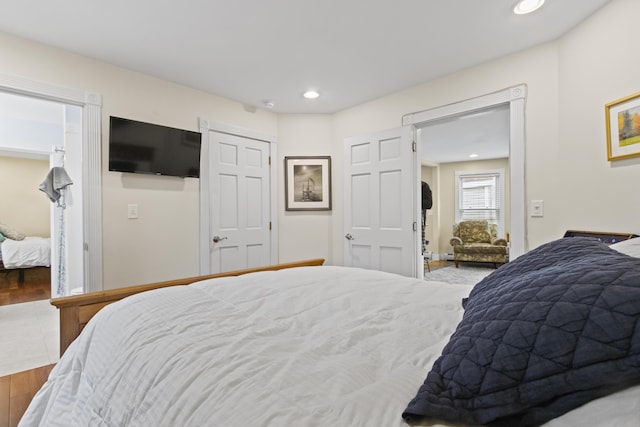 bedroom with hardwood / wood-style floors