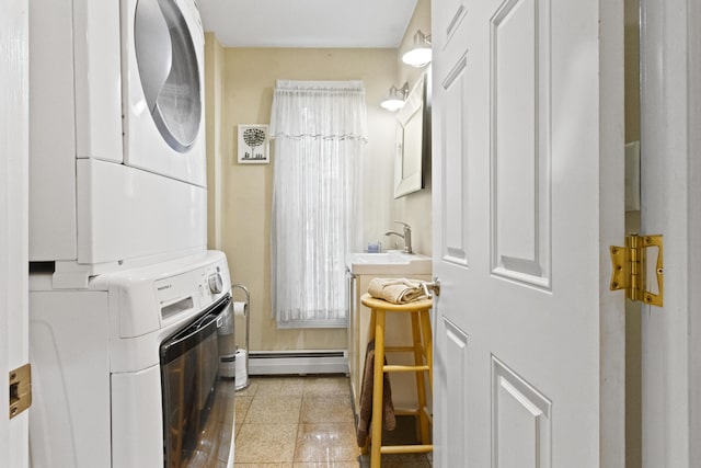 laundry room featuring sink, baseboard heating, stacked washer / dryer, and light tile patterned flooring