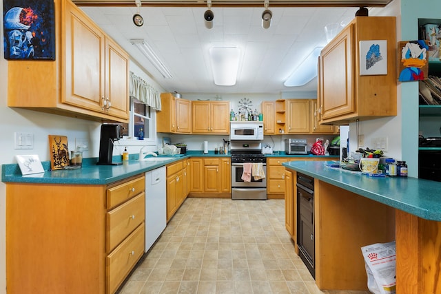 kitchen featuring white appliances and sink