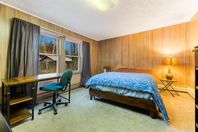 carpeted bedroom with baseboard heating and wood walls