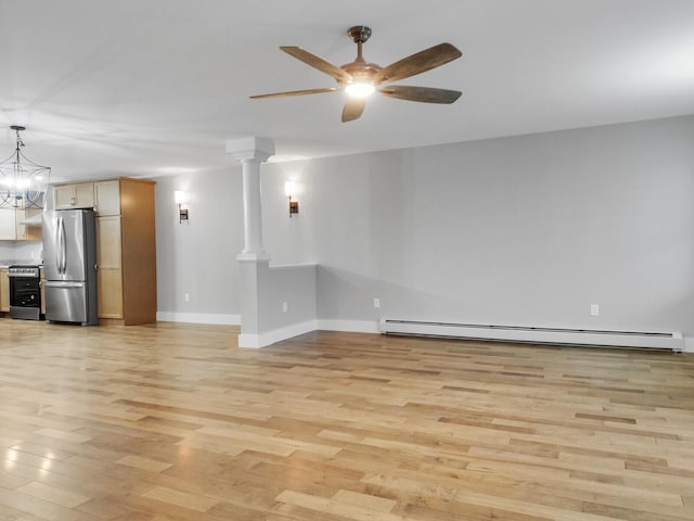 unfurnished living room with ornate columns, ceiling fan with notable chandelier, a baseboard heating unit, and light wood-type flooring