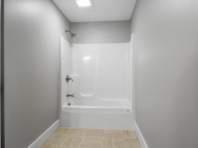 bathroom with shower / washtub combination