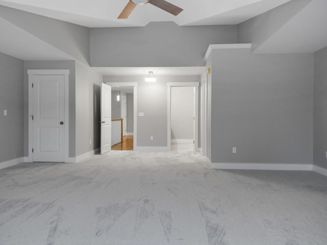 interior space with light colored carpet and ceiling fan