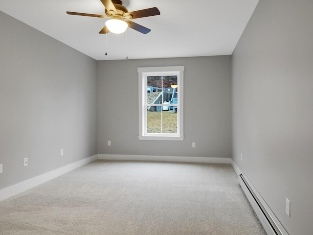 empty room featuring ceiling fan, baseboard heating, and light carpet