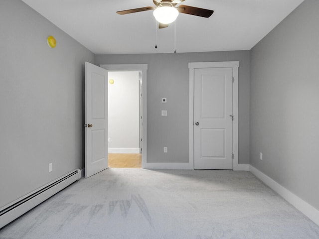 unfurnished bedroom featuring light carpet, baseboard heating, and ceiling fan