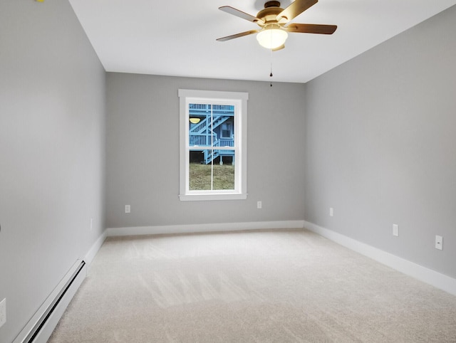 carpeted empty room with baseboard heating and ceiling fan