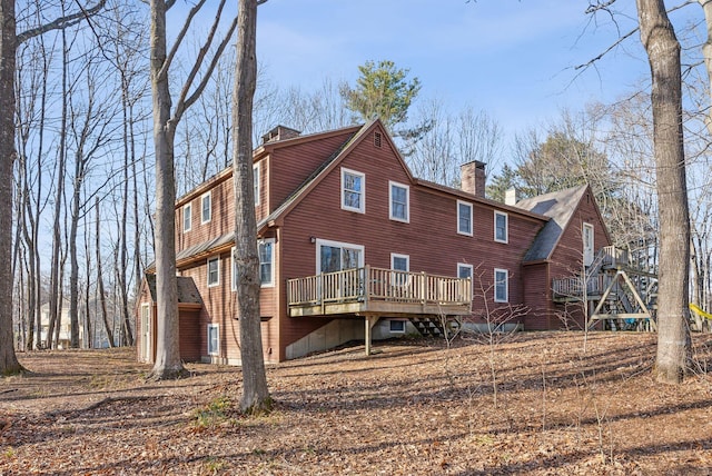 rear view of house featuring a deck