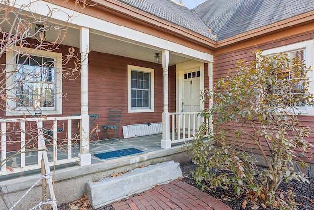 doorway to property featuring covered porch