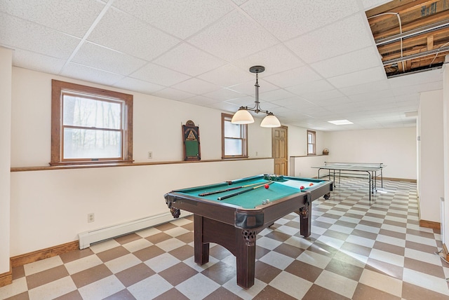 game room featuring a paneled ceiling, pool table, and a baseboard heating unit