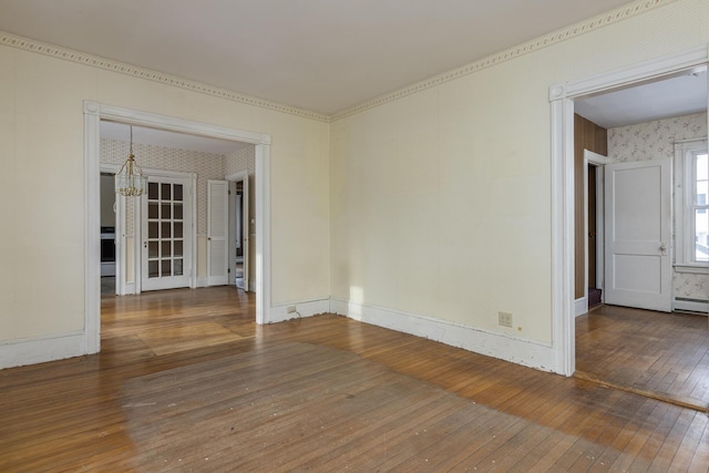 unfurnished room featuring dark hardwood / wood-style floors and a notable chandelier