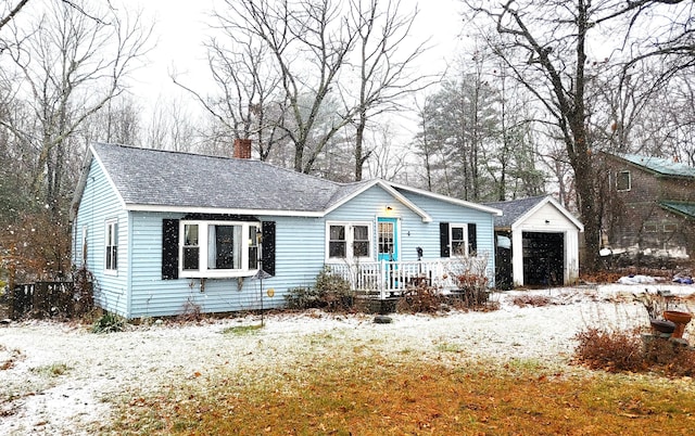 ranch-style house with an outbuilding and a garage