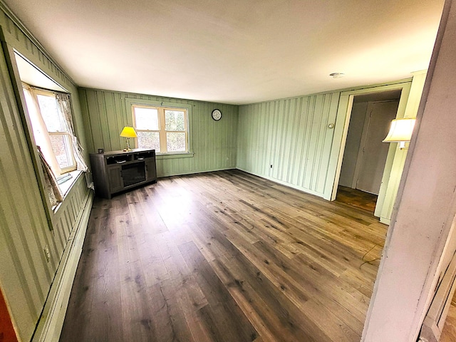 unfurnished living room with hardwood / wood-style flooring