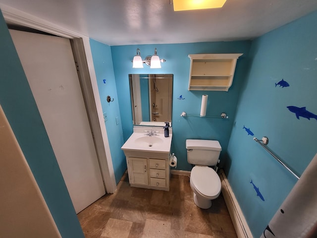 bathroom with vanity, toilet, and walk in shower