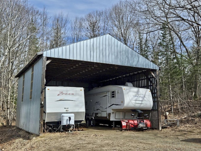 view of vehicle parking featuring a carport