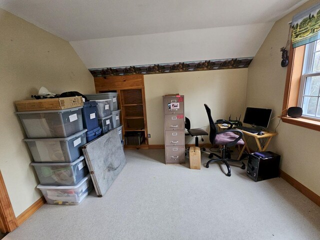 office featuring baseboards, carpet, and vaulted ceiling