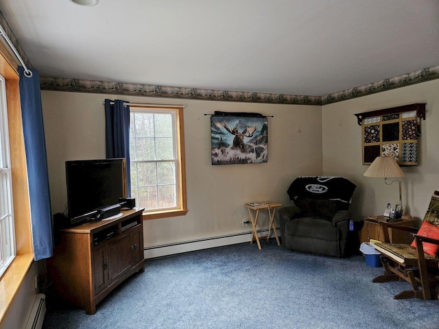 living area with a baseboard heating unit and carpet floors