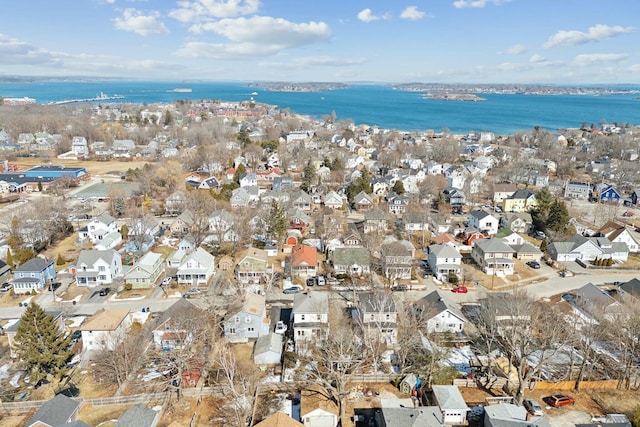 birds eye view of property featuring a residential view and a water view