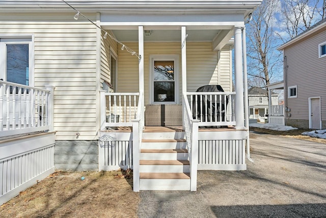 property entrance featuring covered porch