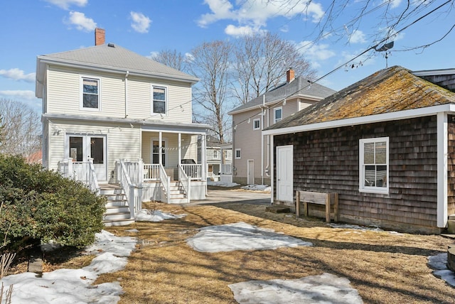 back of house with covered porch