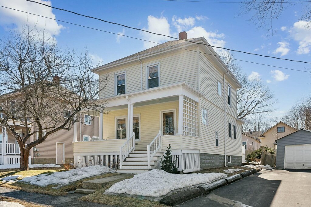 38 Lowell St, South Portland, ME 04106 - american foursquare style home with a detached garage, covered porch, a chimney, an outdoor structure, and driveway