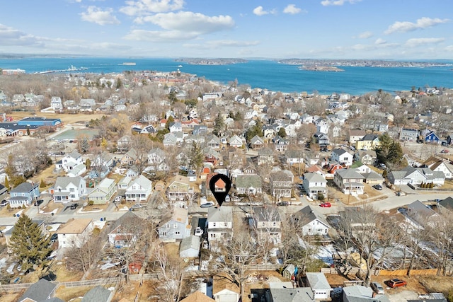 birds eye view of property with a residential view and a water view