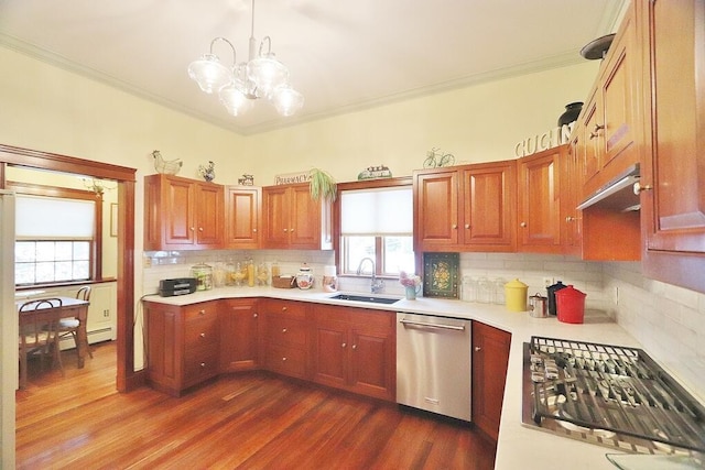 kitchen with pendant lighting, dishwasher, sink, a notable chandelier, and gas cooktop