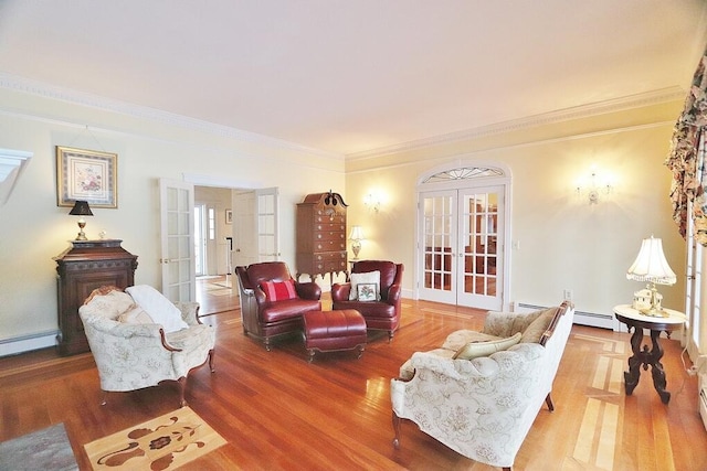 living room with french doors, hardwood / wood-style flooring, a baseboard heating unit, and crown molding