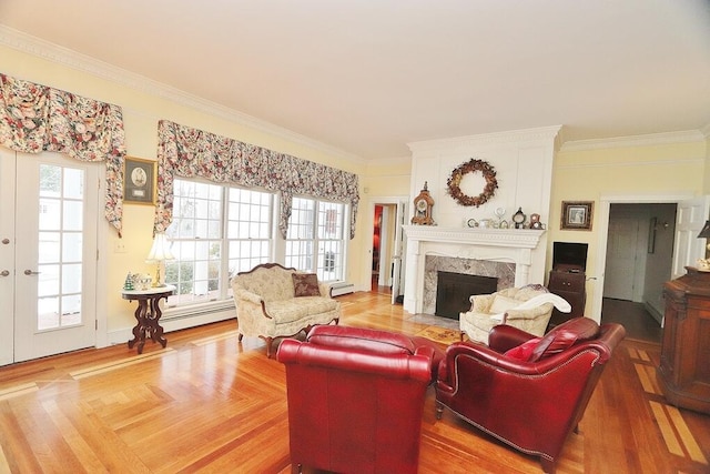 living room with ornamental molding, parquet flooring, a high end fireplace, and a baseboard radiator