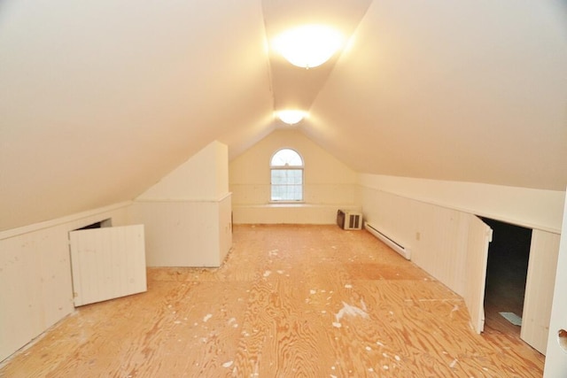 bonus room featuring a baseboard radiator and lofted ceiling