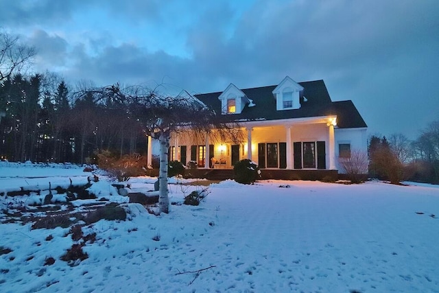 view of snow covered house