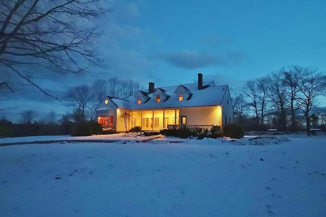 view of snow covered house