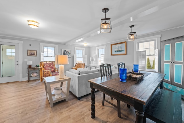 dining room featuring light hardwood / wood-style flooring and ornamental molding