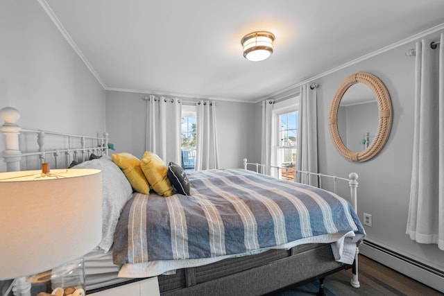 bedroom with baseboard heating and ornamental molding