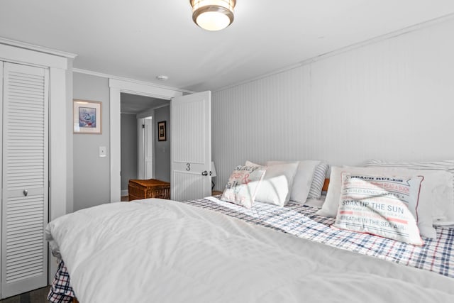 bedroom featuring a closet and ornamental molding