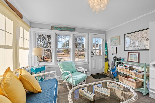 sunroom / solarium with a notable chandelier