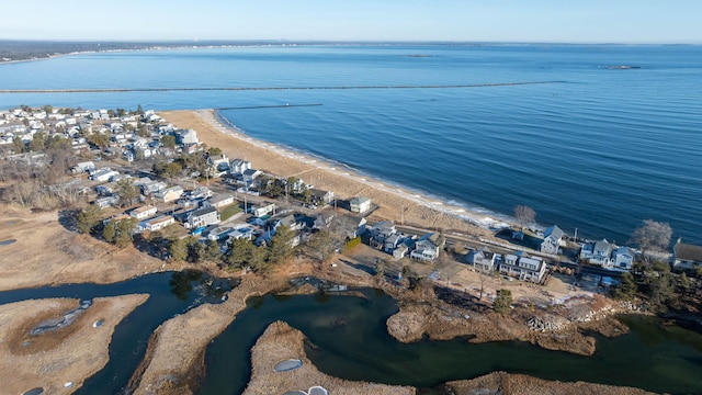 bird's eye view featuring a water view and a beach view