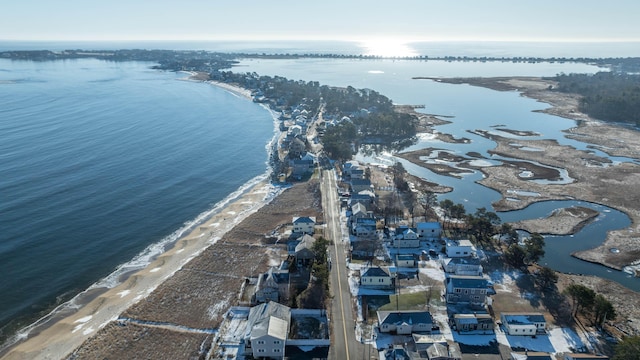 aerial view with a water view and a view of the beach