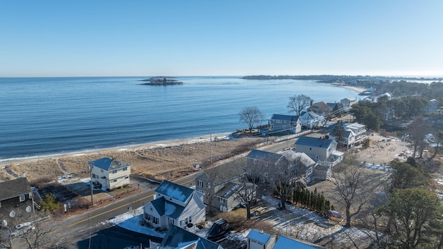 birds eye view of property with a water view and a view of the beach