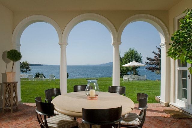 view of patio featuring a water view