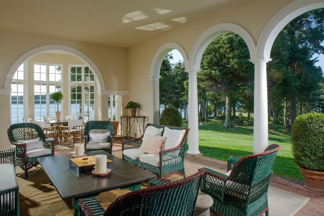 view of patio featuring an outdoor living space and a water view